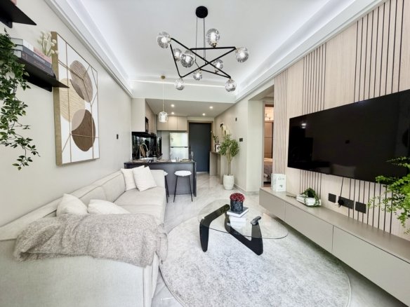Living room couch and Tv Of 1 bedrooms at Oak west Residency In Westlands