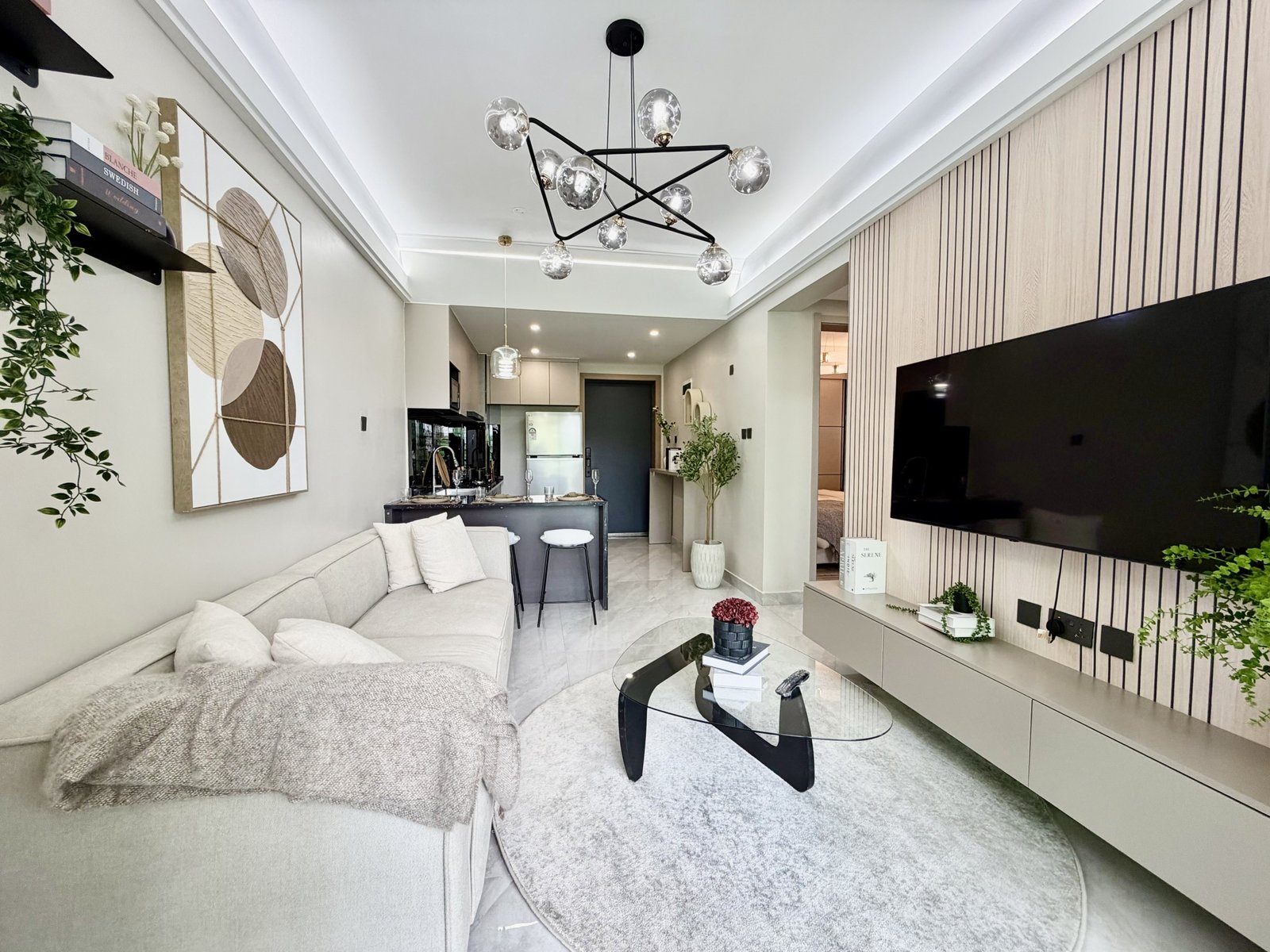 Living room couch and Tv Of 1 bedrooms at Oak west Residency In Westlands