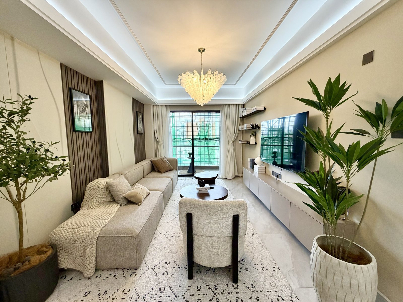Luxury living room tv Of 3 bedrooms At Oak west Residency Apartments in Westlands