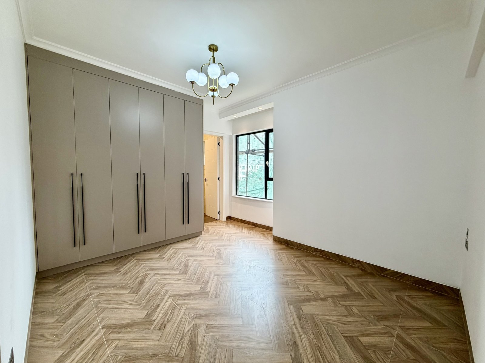 Elegant bedroom area with abundant lighting at Hookwood Residency In Westlands