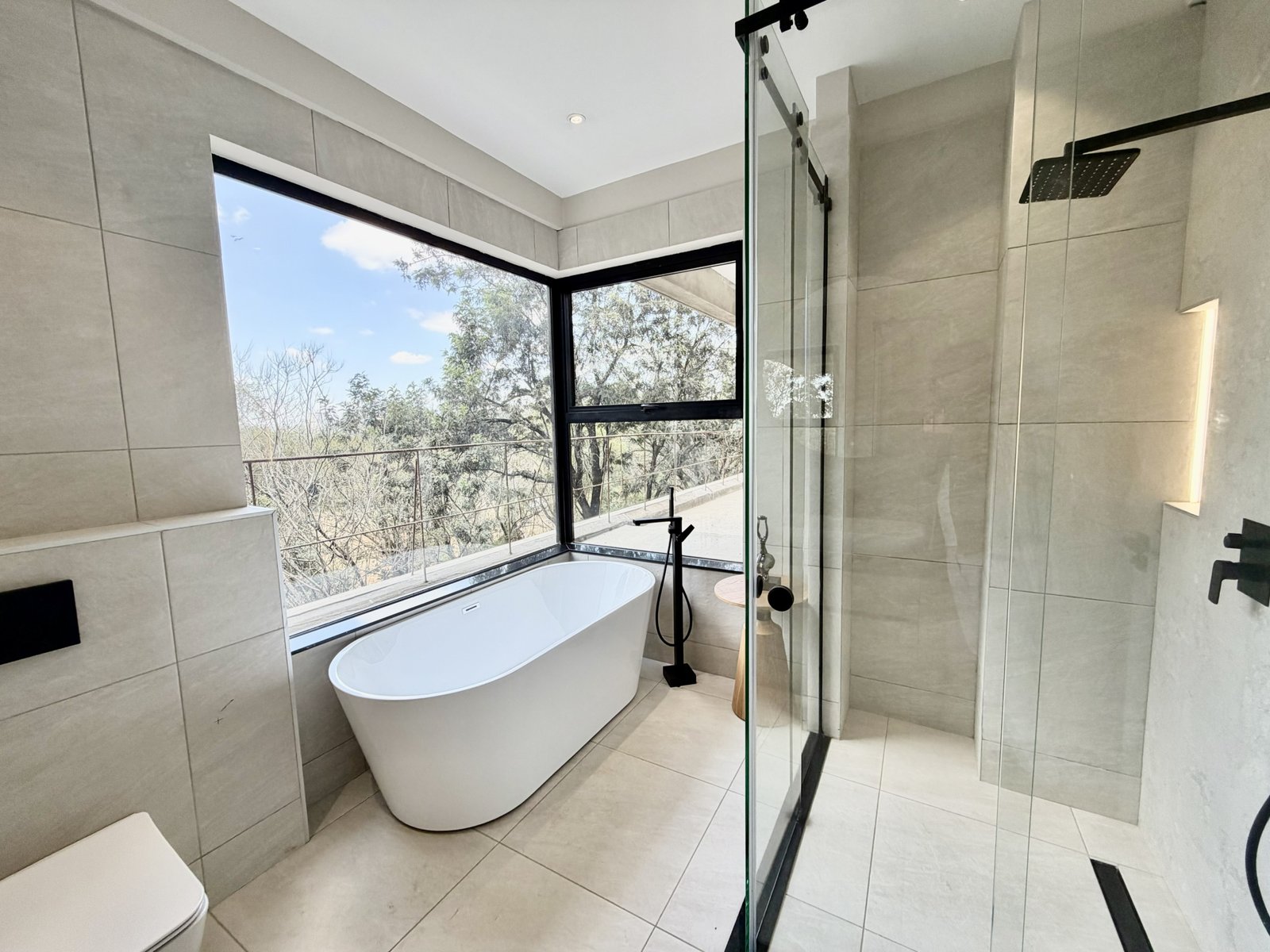 Elegant master bedrooom bathroom at Verona Apartments in westlands